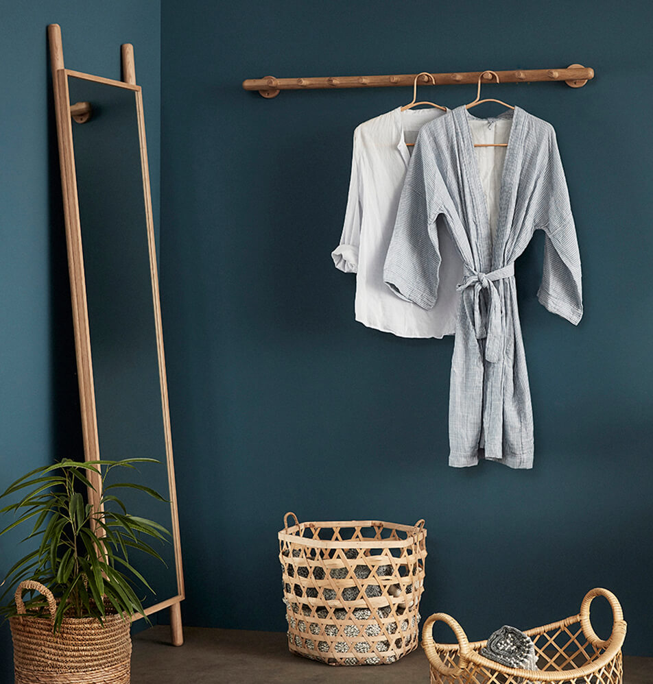 Bathroom decor - wooden baskets, standing mirror in oak, hangers and bathrobe